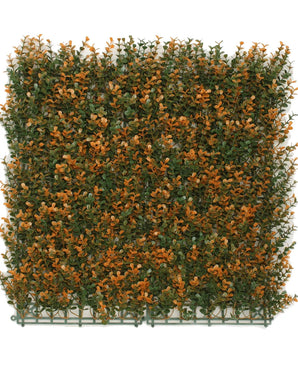 De Kunsthaag Buxus oranje 50x50 cm UV is een vierkant kunstgroenpaneel met dichte groene en oranje bladeren op een kunststof drager, ontworpen om een haag of tuinmuur te imiteren.